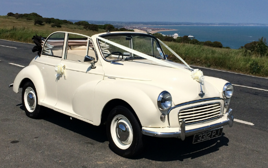 Morris Minor Convertible With Roof down and Wedding Ribbons